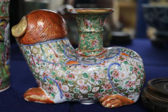 A Japanese Kutani porcelain lion dog candlestick, enamelled and gilt decoration and a Canton vase candlestick height 10cm